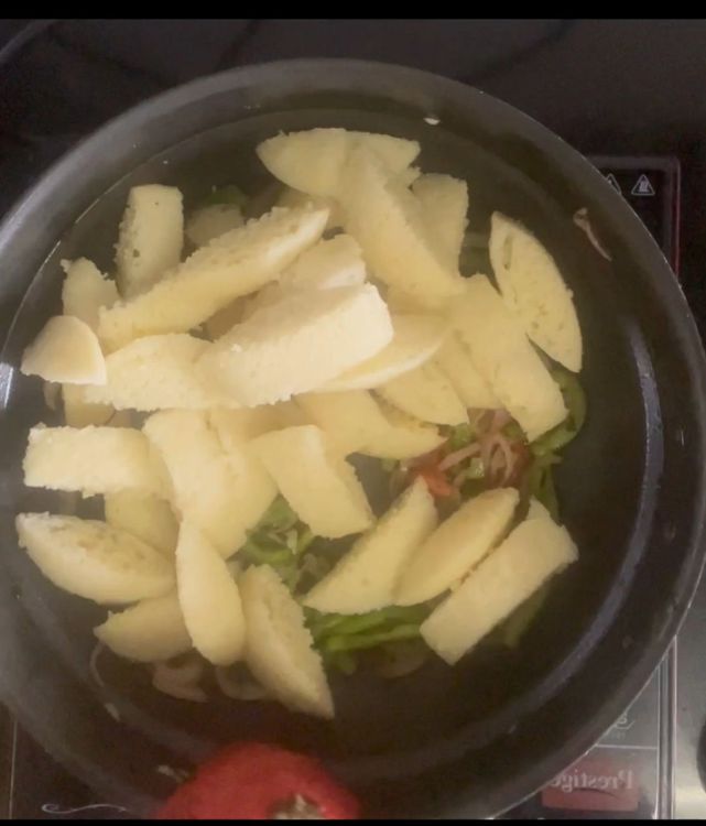 Step 1.1: Add all idli pieces followed by crispy peanuts