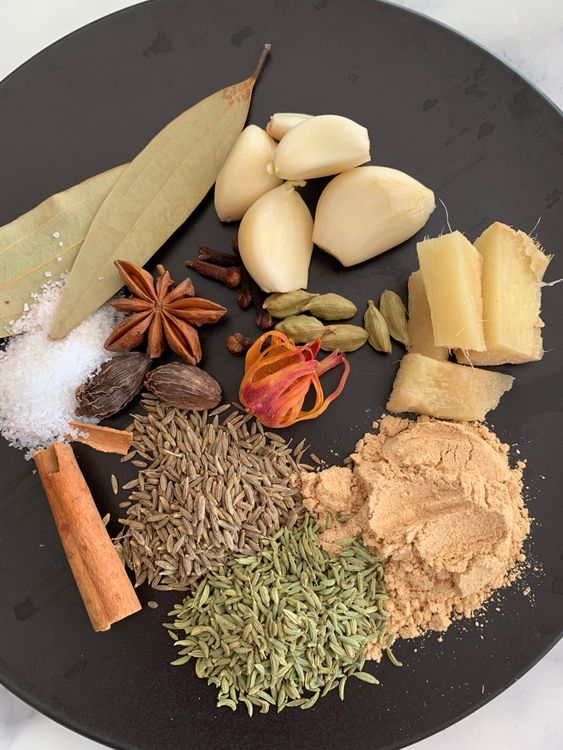 Step 3.1: Add all the whole spices, sliced ginger, garlic cloves, dry ginger powder, and salt