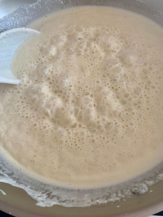 Step 4.1: Cook on high heat, stirring continuously until the curd comes to a gentle boil