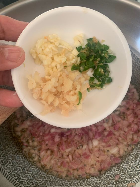 Step 2.1: Stir in ginger, garlic, and green chillies