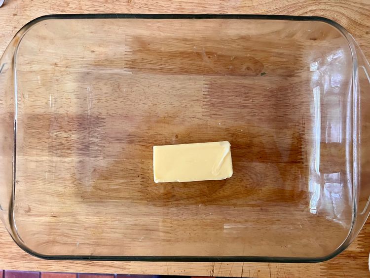 Step 1.1: Place the stick of butter in a 9” by 13” pan
