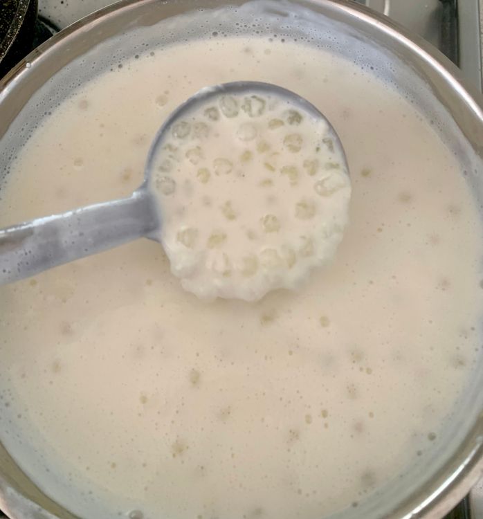 Step 3.2: In a heavy-bottomed pan, bring the milk to a gentle boil