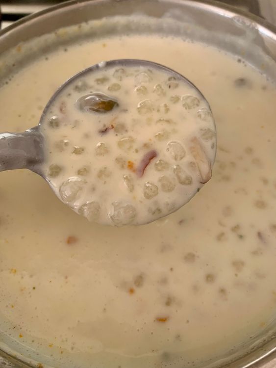 Step 5.3: Add sugar, cardamom powder, and 3 tablespoons of the roasted nuts (reserve 1 tablespoon for garnish), along with saffron strands if using