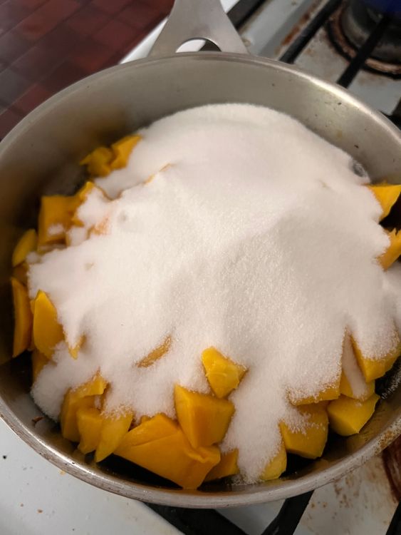 Step 1.1: Add in the mangoes, sugar, and vinegar and stir to combine