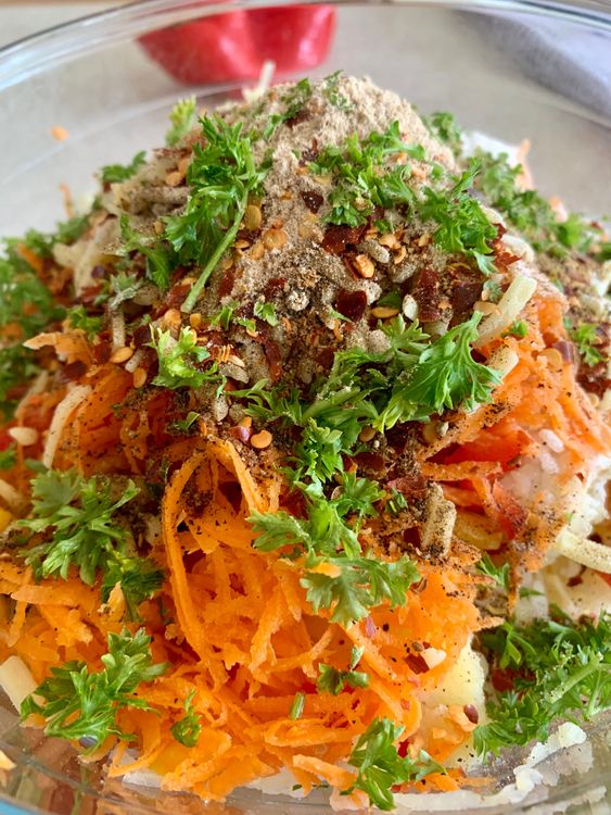Step 1.2: Add the drained poha, carrot, bell pepper, corn kernels, rice flour, grated cheese, chopped coriander leaves, black pepper powder, cumin powder, garam masala, amchur powder, red chilli flakes and salt