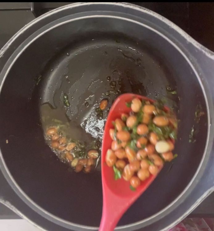 Step 1.1: Now take out the peanuts and curry leaves mix in a bowl
