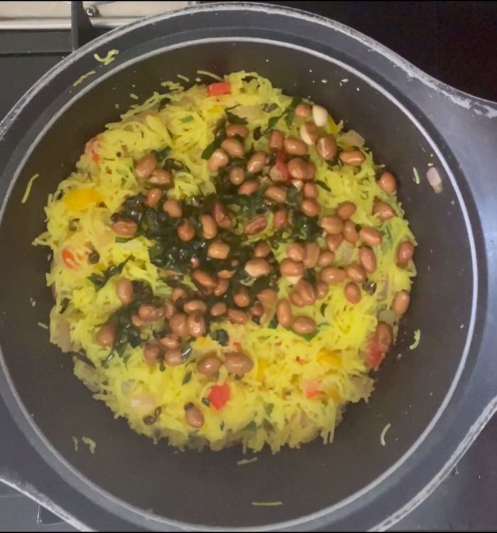 Step 1.1: Once the colour is changed add curry leaves and peanuts

