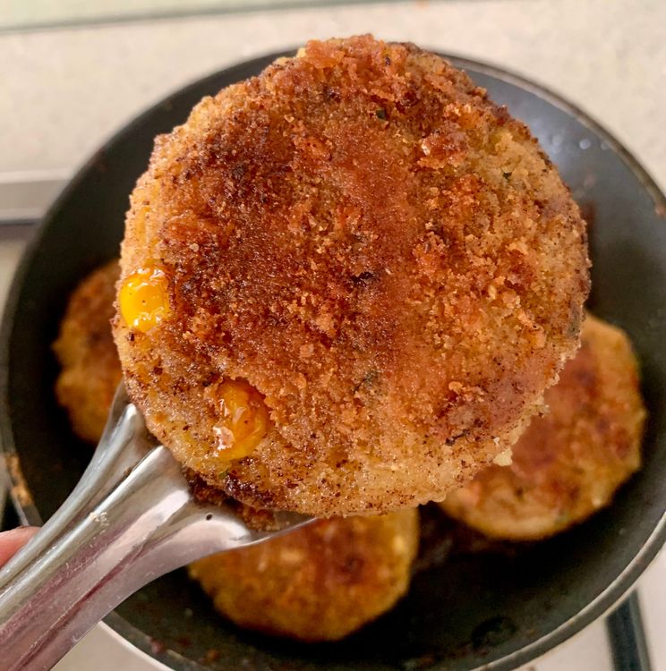 Step 3.2: Once the oil is hot, place the coated cutlets carefully into the pan