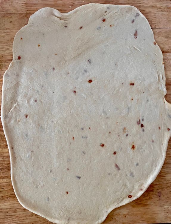Step 1.1: Take the dough out of the bowl and place on a clean, flat surface