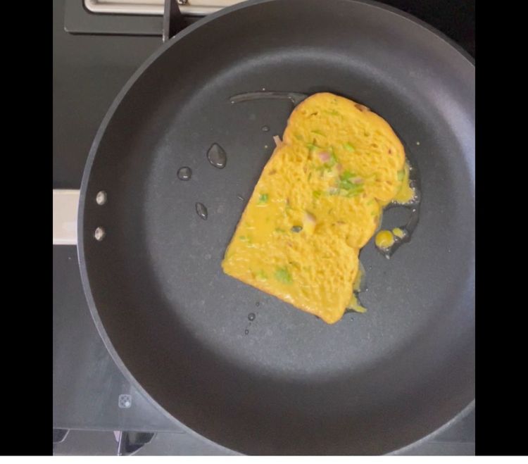 Step 1.2: In a non stick pan add little oil and put the dipped slice over it
