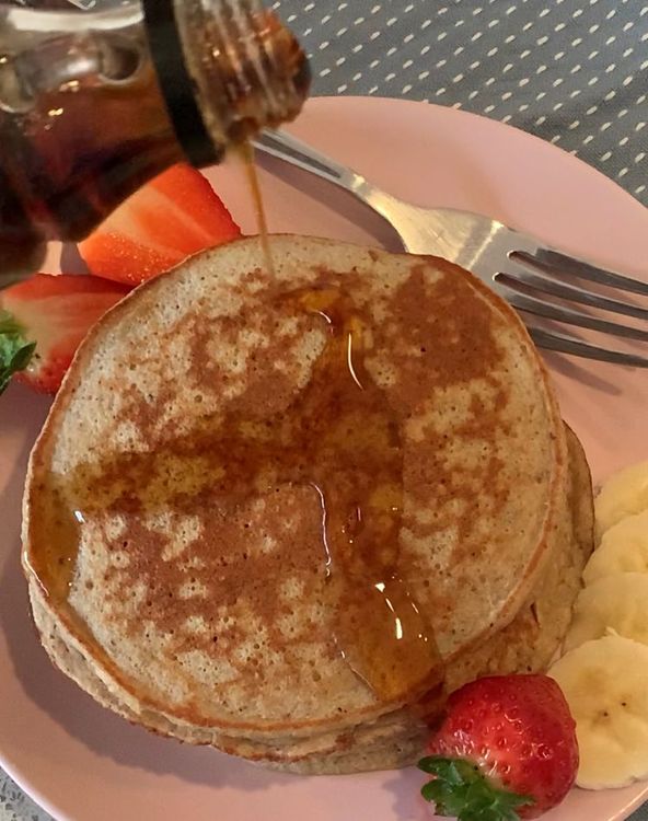 Step 1.1: Serve the pancakes with maple syrup, sliced banana and strawberries on top