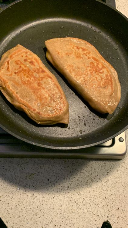 Step 2.2: Place the stuffed paratha on the hot skillet and cook for 3-4 minutes