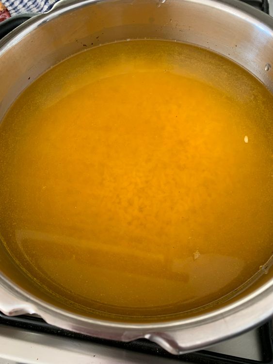 Step 1.1: If using a pressure cooker, add the soaked rice and dal to the cooker with water, salt, and turmeric