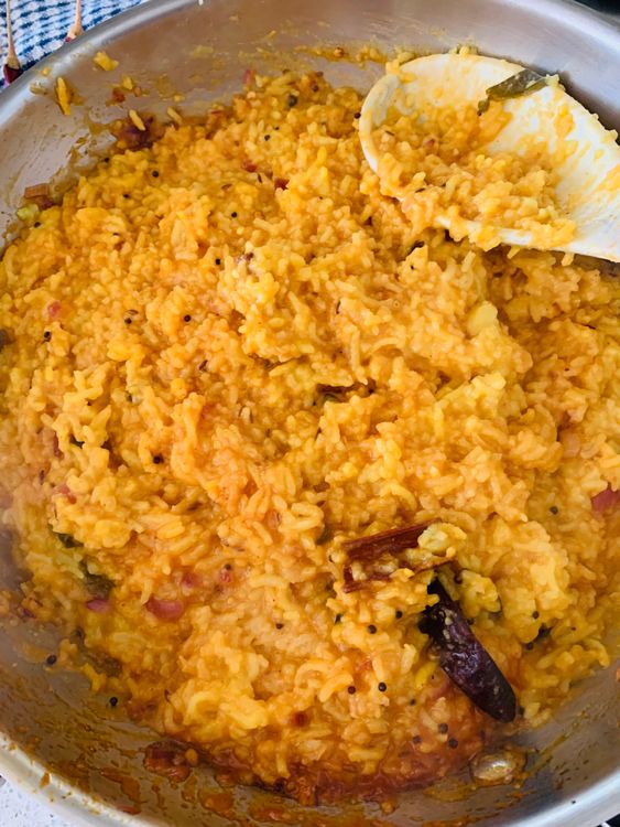Step 3.2: Add the cooked rice-dal mixture to the kadhai and mix well with the masala
