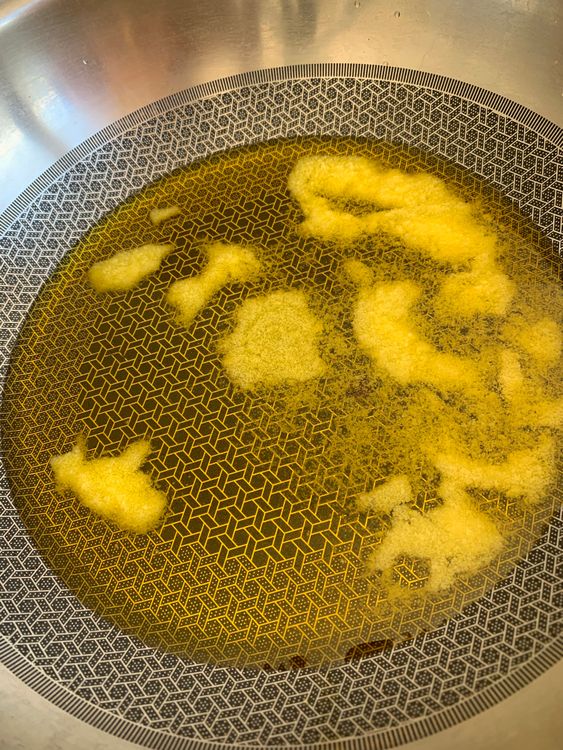 Step 1.1: In a heavy-bottomed kadai or pan, melt ghee over low-medium heat