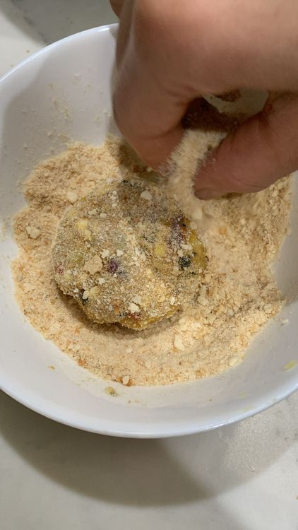 Step 1.1: Roll the sago cutlet in breadcrumbs and set it aside