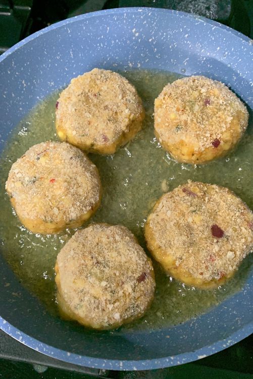 Step 2.1: Place sago cutlets into the oil one at a time, making sure not to overcrowd the pan