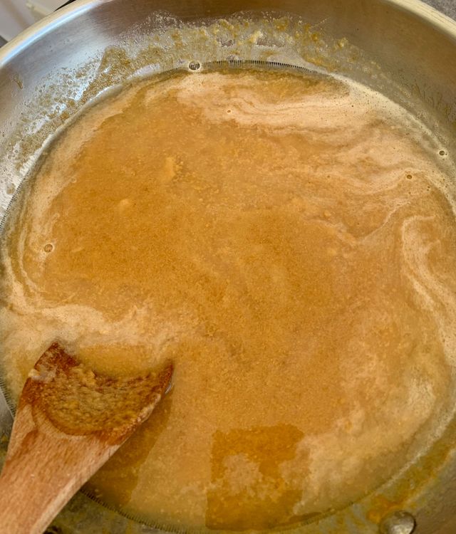 Step 1.1: Carefully pour water into the kadai or pan, as the mixture may bubble and splutter