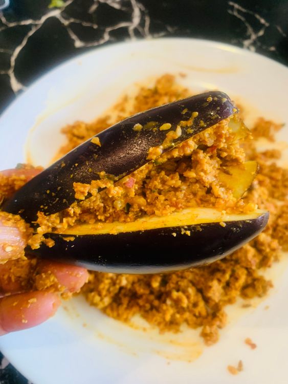 Step 2.1: Gently stuff each brinjal with the prepared masala paste
