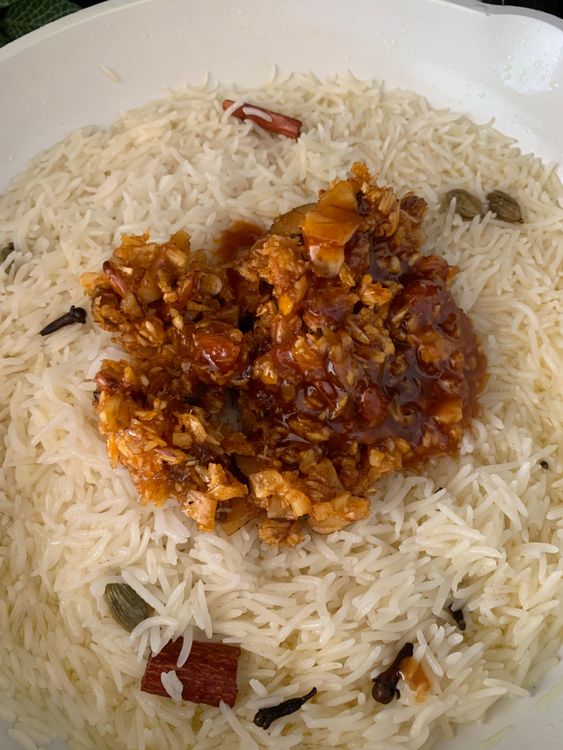 Step 3.1: Once the rice is cooked, add the coconut-jaggery mixture and mix gently