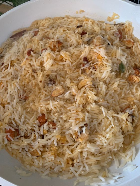 Step 3.2: Once the rice is cooked, add the coconut-jaggery mixture and mix gently