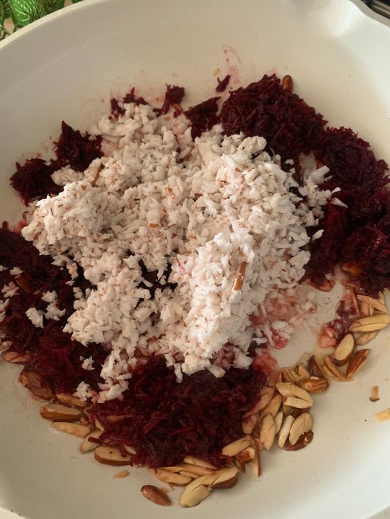 Step 1.1: Add the grated beetroot and coconut to the pan