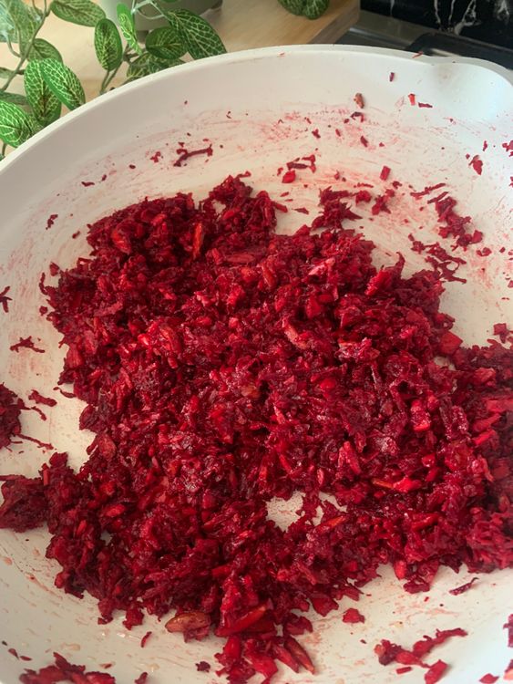 Step 1.2: Add the grated beetroot and coconut to the pan