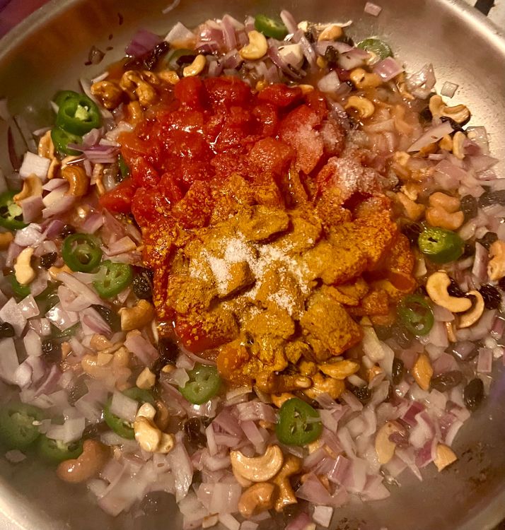 Step 2.1: Add the tomatoes, turmeric, and 1 tsp kosher salt