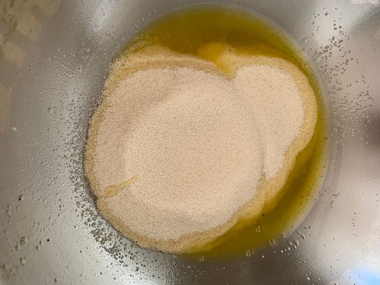 Step 2.1: In the same pan, add suji and roast on medium-low heat, stirring constantly, until it turns golden and releases a nutty aroma