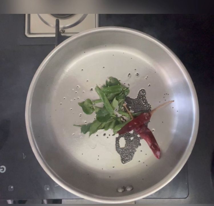 Step 1.1: Add jakhiya,curry leaves and dry red chillies