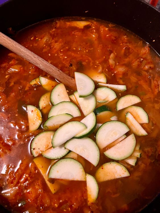 Step 1.1: Add the vegetable broth, soy sauce, and zucchini