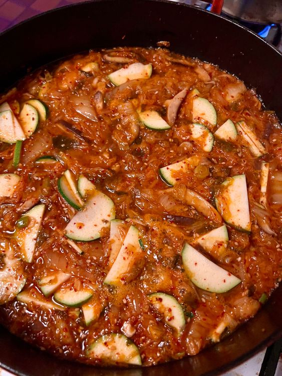 Step 1.2: Add the vegetable broth, soy sauce, and zucchini