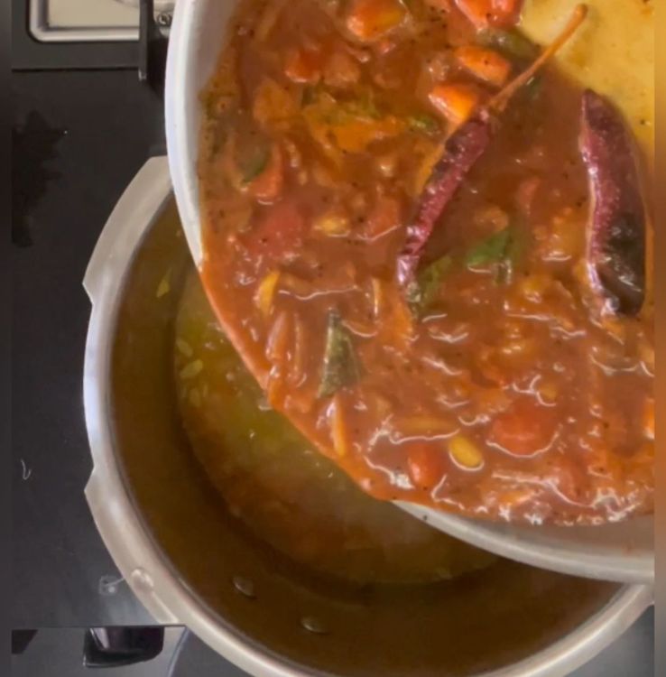 Step 1.1: Add boiled tamarind water into the daal mixture in the cooker