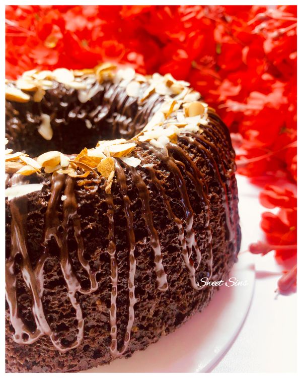 Step 1.1: When the cake is cooled down decorate the cake with chopped nuts and chocolate ganache drizzle on the top