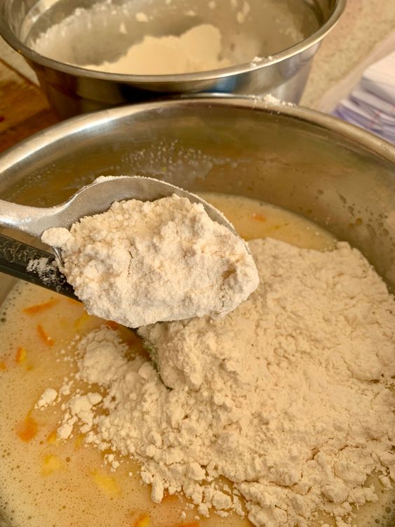 Step 4.2: Pour in the orange juice, then gradually fold in the dry ingredients
