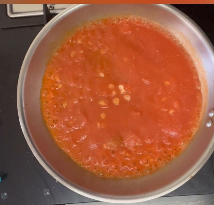 Step 1.2: In a pan take oil and add minced garlic followed by tomatoe puree