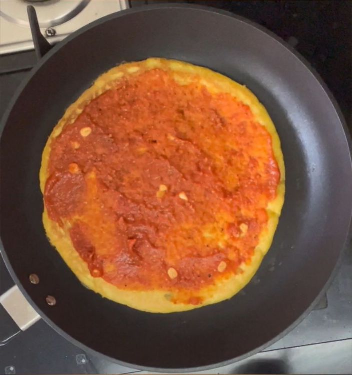 Step 1.1: Add pizza puree followed by vegetables