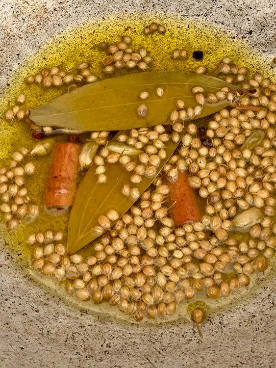 Step 2.1: Add bay leaves, cinnamon sticks, cardamoms, cloves, coriander seeds, and peppercorns