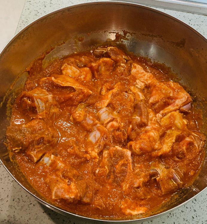 Step 1.3: Marinate the mutton pieces in a mixing bowl with the ground paste, degi mirch powder and salt