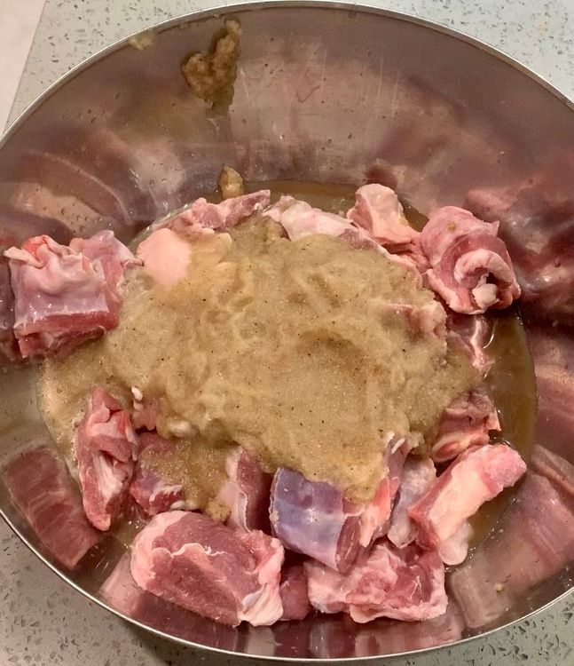 Step 1.2: Marinate the mutton pieces in a mixing bowl with the ground paste, degi mirch powder and salt