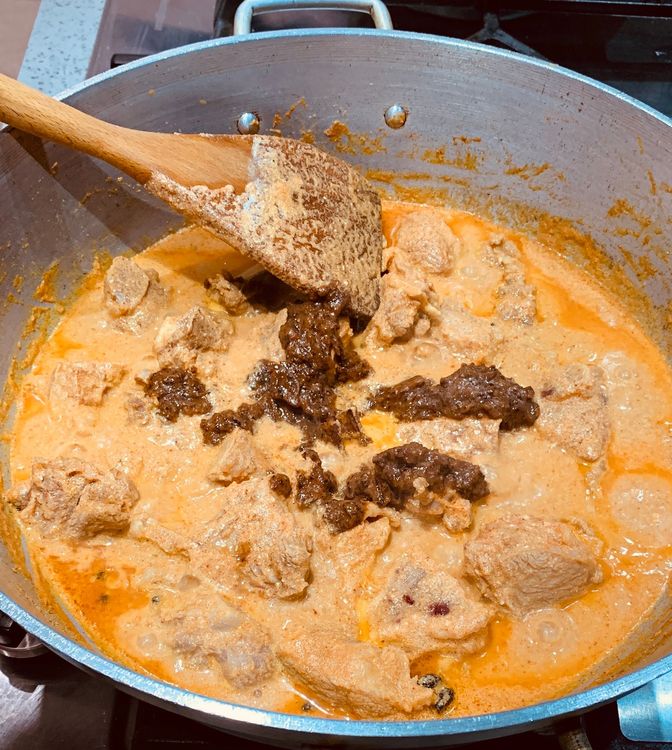 Step 3.1: Mix in the ground onion paste and cook for 4-5 minutes, stirring occasionally