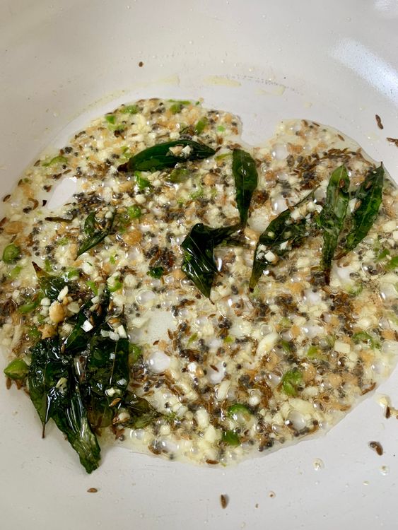 Step 1.1: Add chopped garlic, ginger, green chillies, and hing