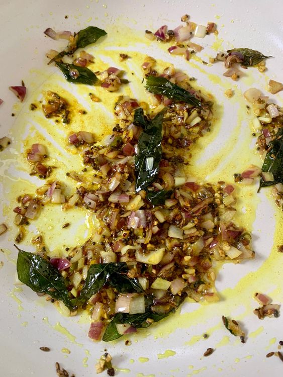 Step 1.1: Mix in turmeric and salt, then add the mashed potatoes