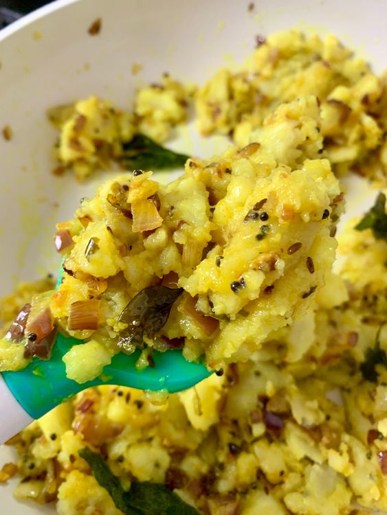 Step 1.3: Mix in turmeric and salt, then add the mashed potatoes