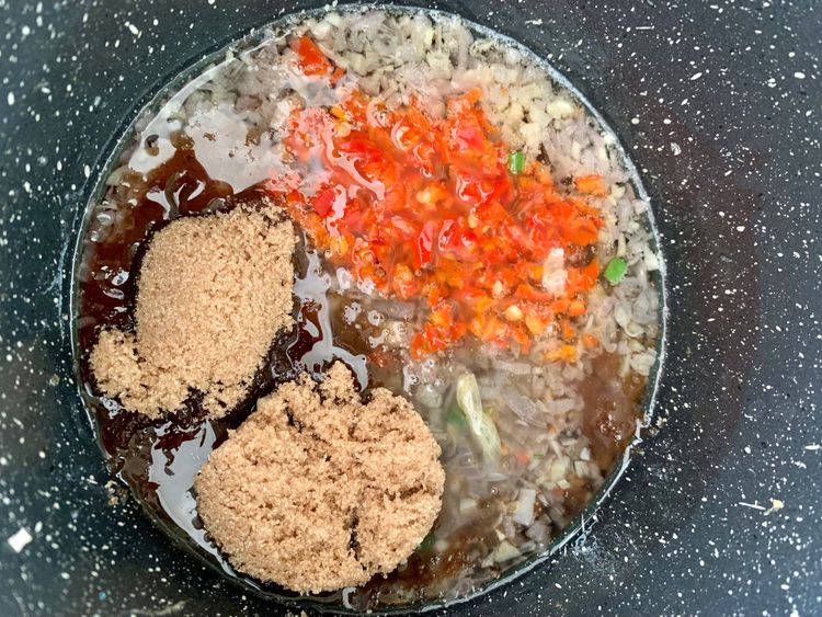 Step 2.1: Add fish sauce, brown sugar, and chopped chillies