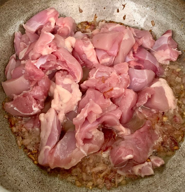 Step 1.1: Stir in chicken pieces until they change colour over high heat
