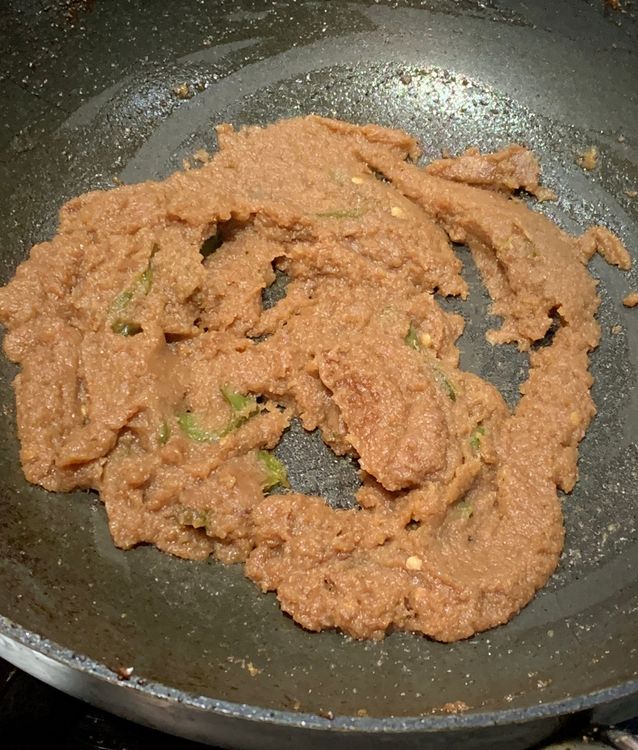 Step 3.2: Add the ground onions and green chillies and stir