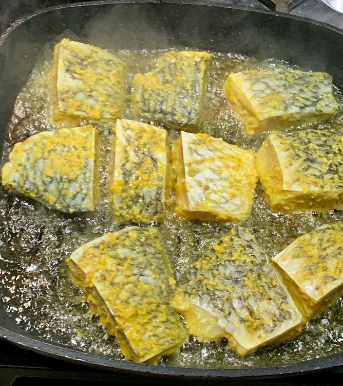 Step 1.1: Add the marinated fish to the oil one at a time, being careful not to overcrowd the pan