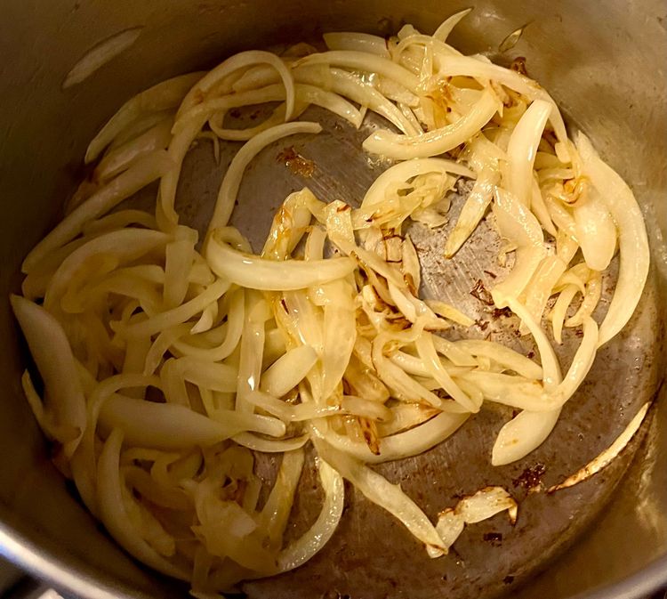Step 2.2: Once hot enough, add the sliced onions, and sprinkle with a little kosher salt