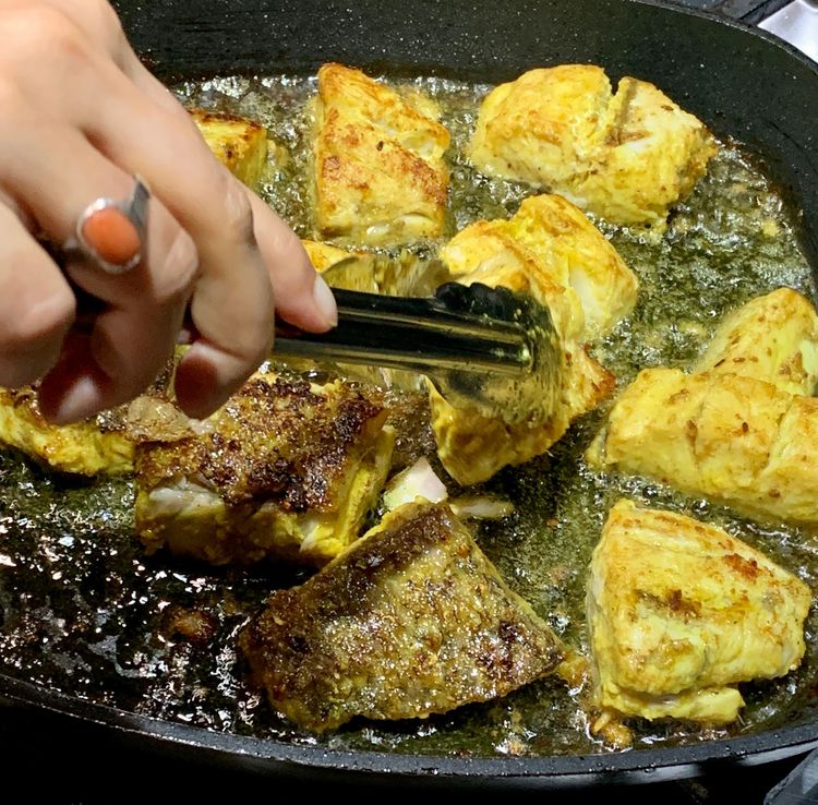 Step 1.1: Allow the fish to cook untouched for a few minutes until they become crisp
